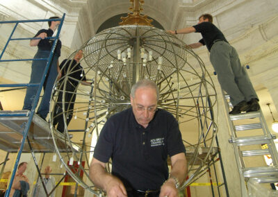 Acu-Bright team restoring chandelier